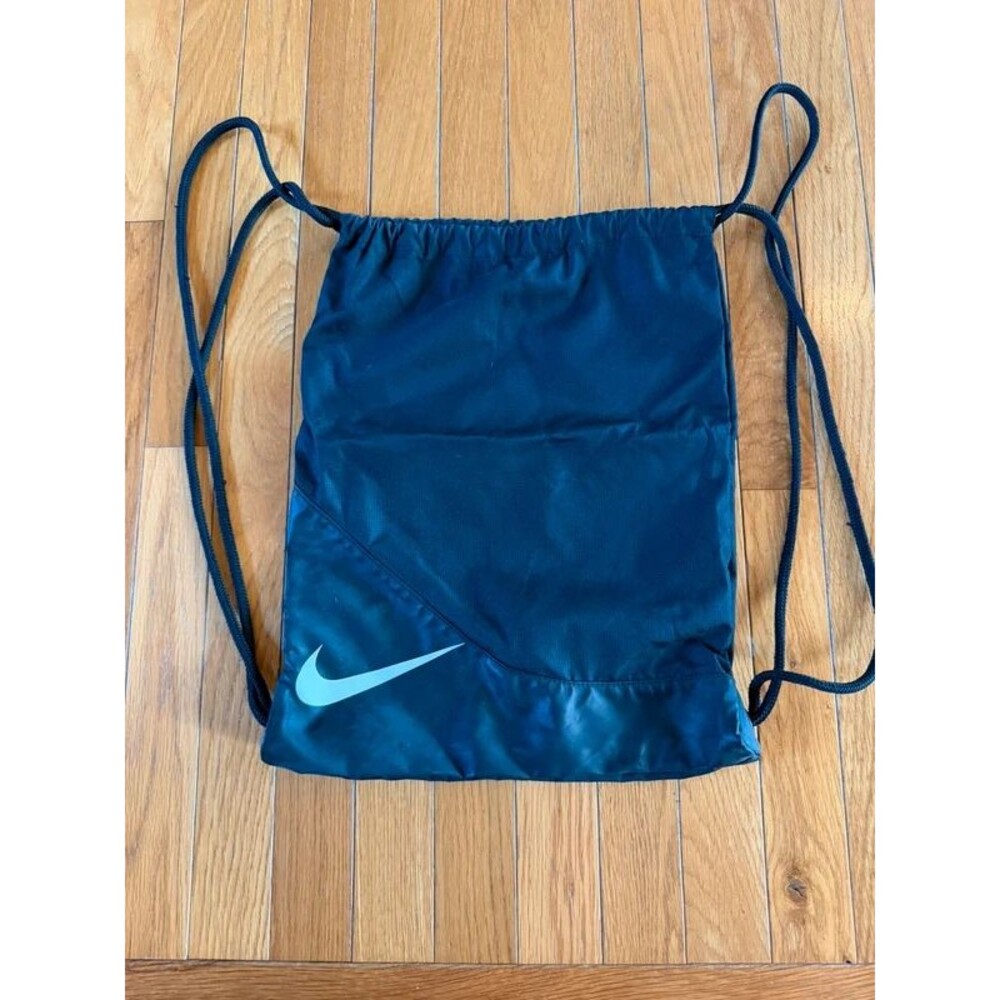 Nike black drawstring gym bag with a white swoosh logo